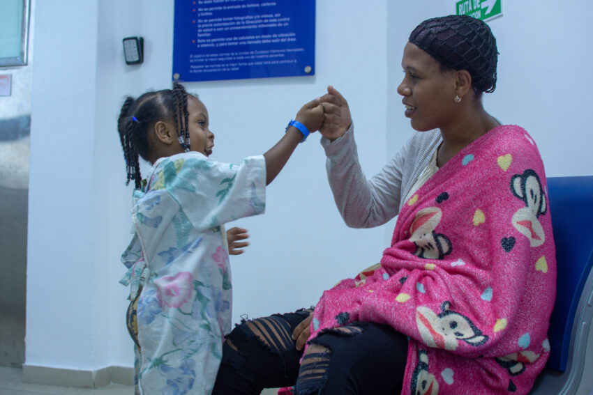 Mother and daughter have a special moment before the child's surgery.