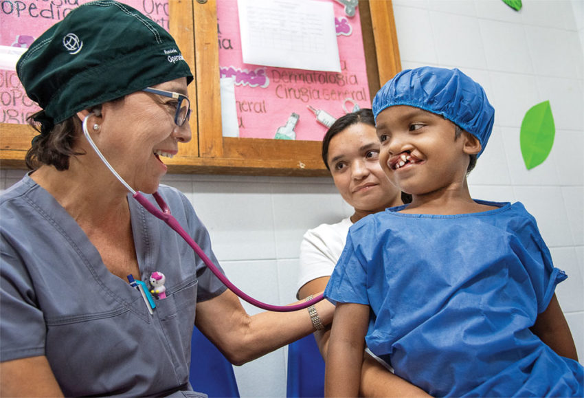 Colombian pediatrician and credentialed Operation Smile volunteer Dr. Teresa Rodriguez treats seven-year-old Pedro of Venezuela at our care centre in Riohacha, Colombia.