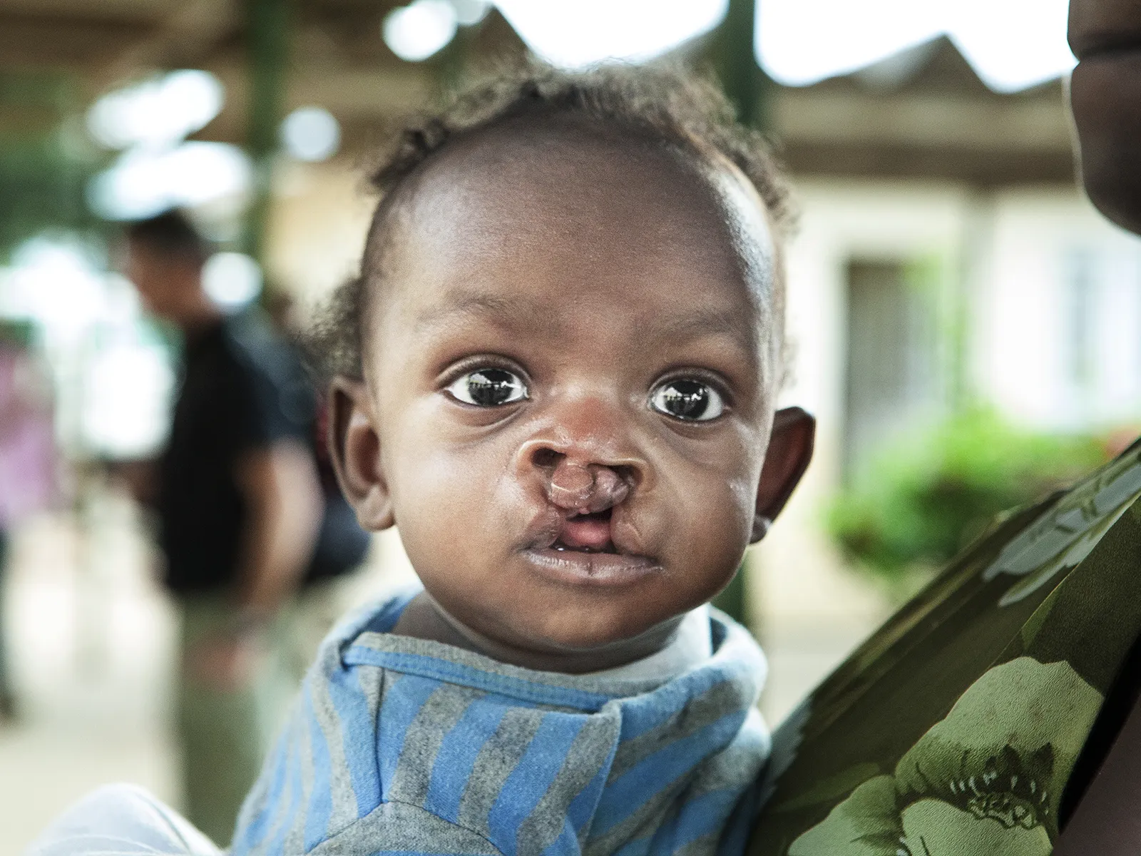 Kaleb stares into the camera with his big, beautiful eyes.
