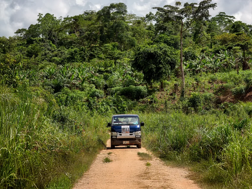 Clement Ofosuhemeng_ Traveling on a remote road to Faustina's village.