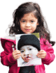 Child holding her before cleft surgery photo