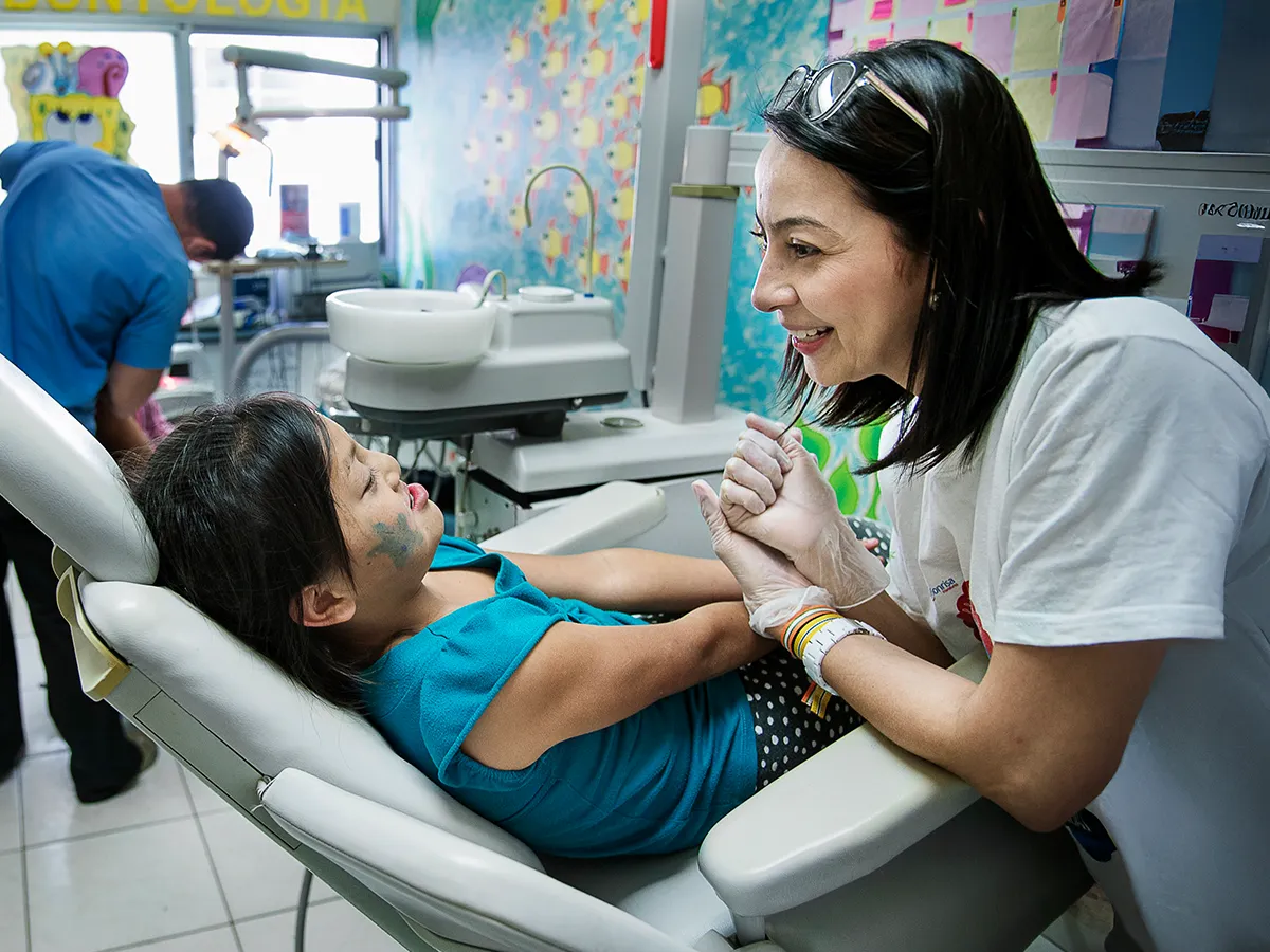 Dentist Carmi Rivera examines a child at the Operation Smile Cleft Lip and Cleft Palate Integral Care Clinic in Tegucigalpa, Honduras