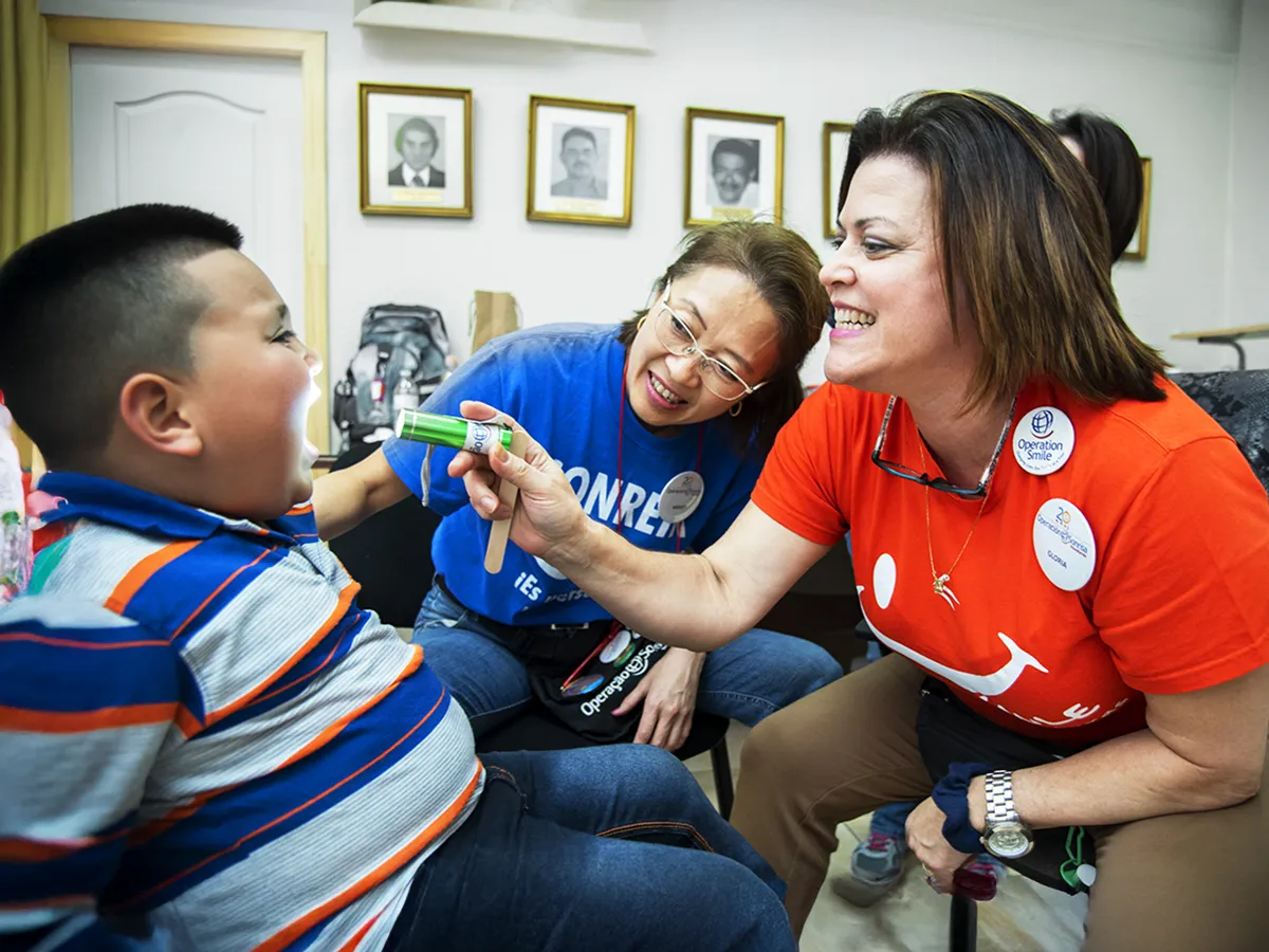 Josue Jahir Torres, 5 yrs, male, with Speech Pathologists Midori Hanayama from Brazil and Gloria Vilches from Honduras