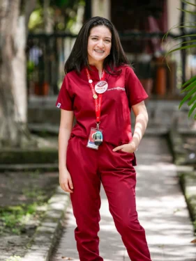 Angie, a student advocate from Honduras, smiling confidently, proud of the impact she has created.