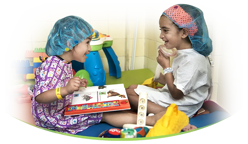 Nury Yaritza Carrasco Vargas , left, 4 , female, plays with Kemberly Dayana Ayala Perdomo, 8 years, female, in the Child Life area before surgery during the Operation Smile mission at San Felipe Hospital in Tegucigalpa, Honduras February 20, 2017.