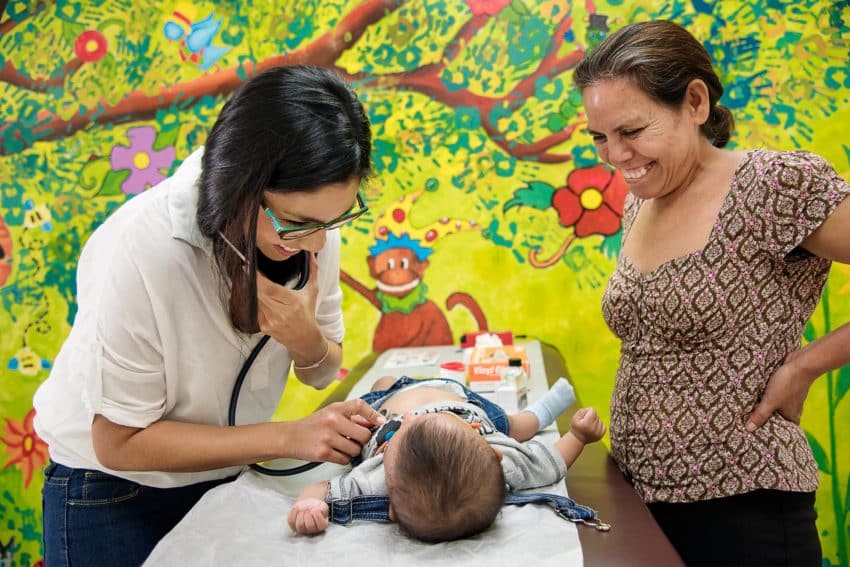 Doctor examining child at Honduras Care Centre