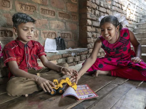 Shyam and his sister, from India, play happily.