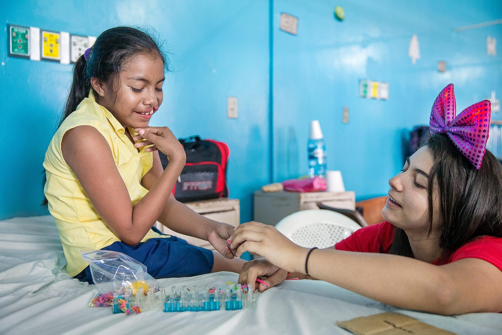 Iris plays with an Operation Smile staffmember