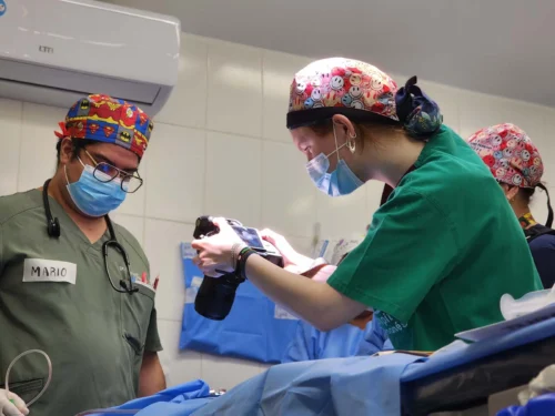 Photography Imaging Technician (PIT), Kate Fischer, capturing photos of the patient's cleft condition before surgery begins.