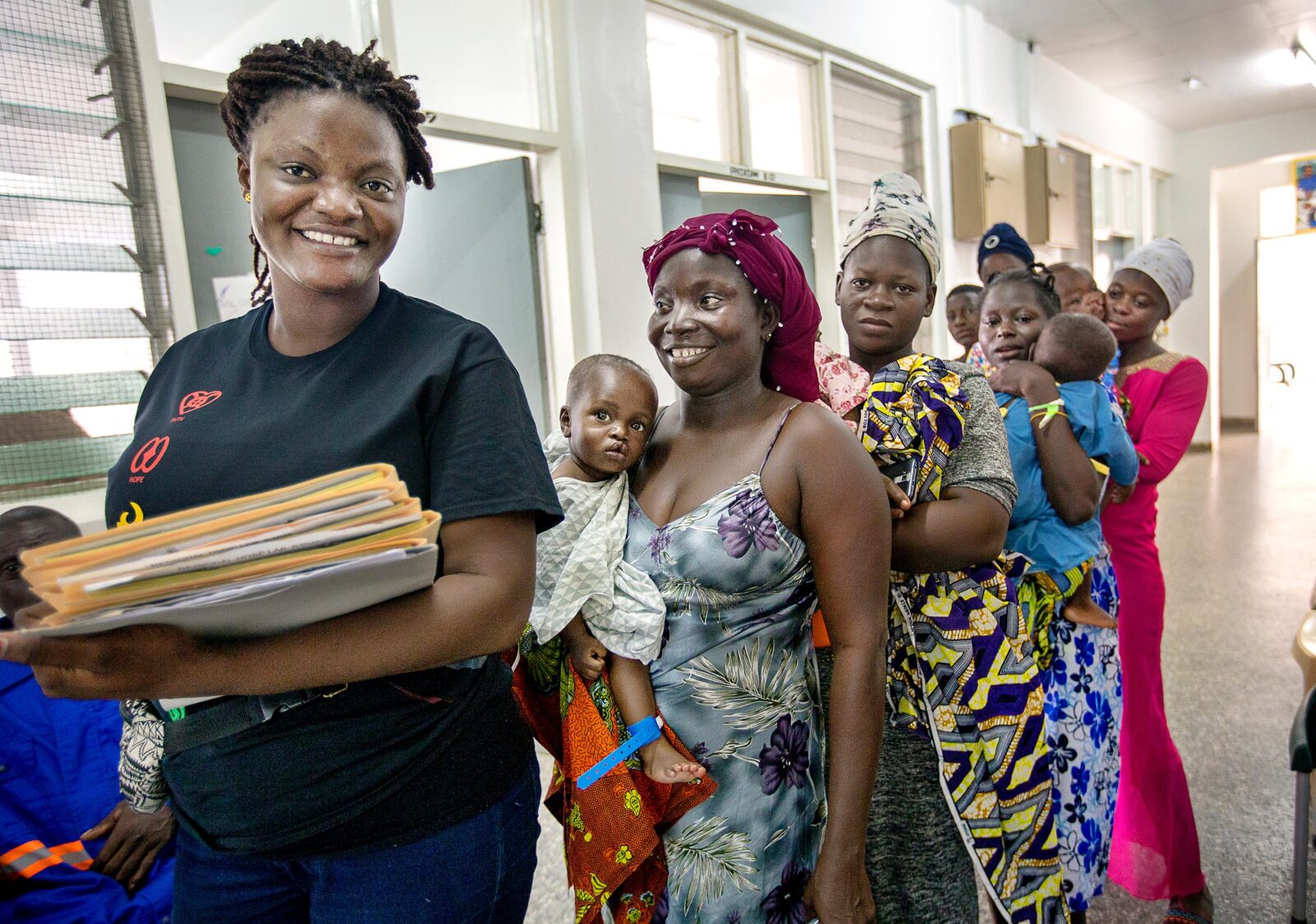 Ghana Program Coordinator Lucy Apeajei with patients