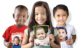 Three children holding their before cleft surgery photos