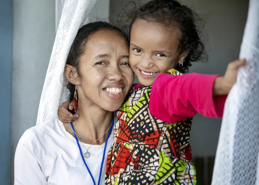 Nina and Joyce, mom and daughter, smile brightly months after receiving cleft surgery.