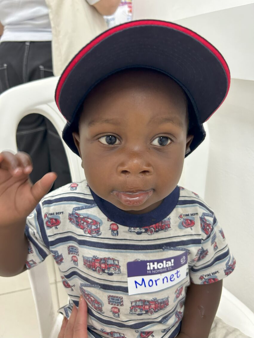 Child wearing a baseball cap