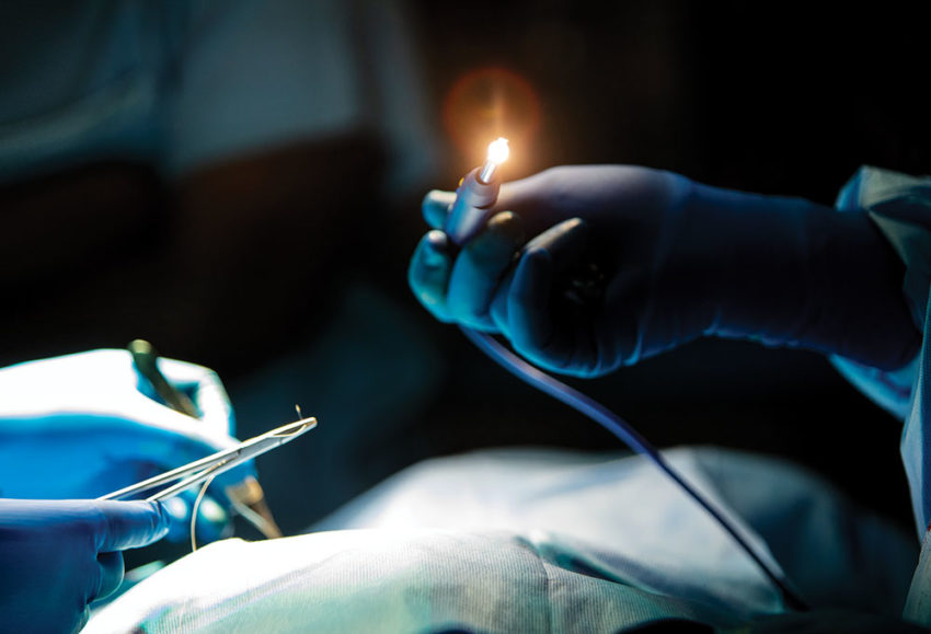 An Operation Smile volunteer uses a photon blade, a highly advanced surgical tool donated by one of our corporate partners, during a recent medical mission in Rwanda.