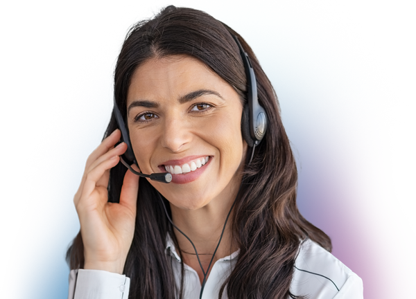 A smiling women wearing a telephone headset