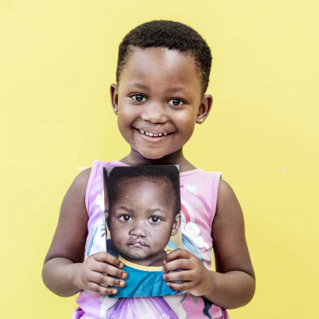 Girl holding picture of herself